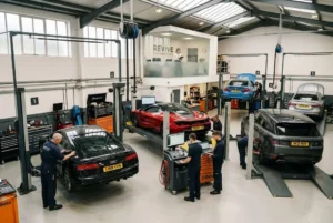 Auto service garage with technicians working efficiently in a UK workshop